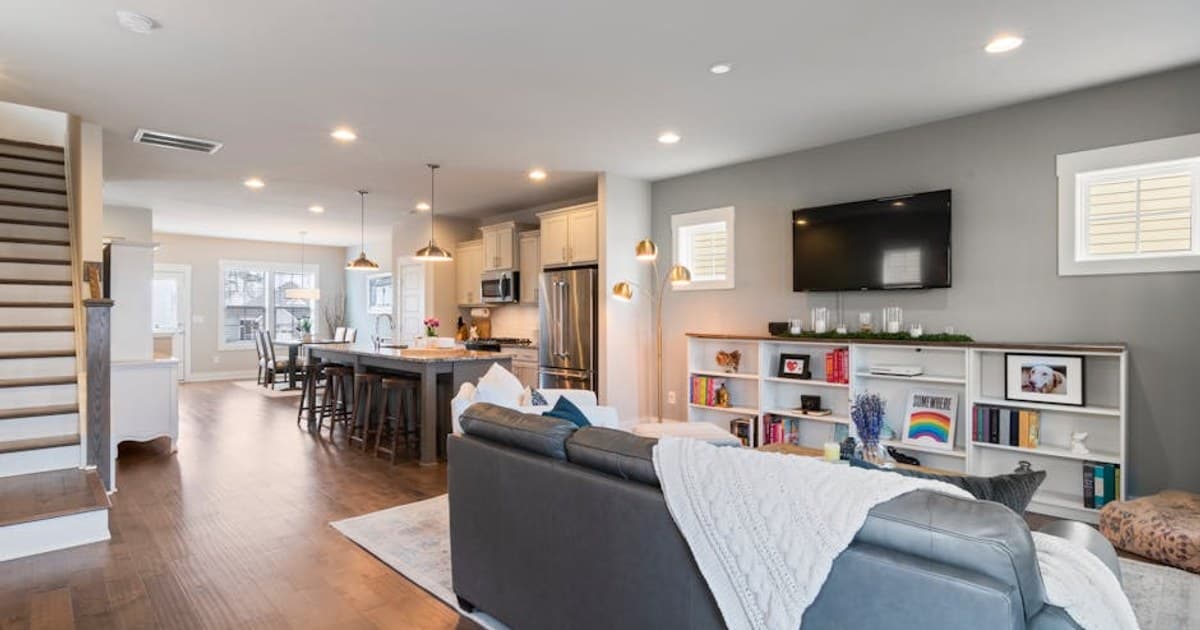 Bright and airy living space with open kitchen and modern decor creating a welcoming ambiance.